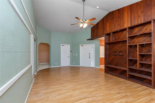 a view of a livingroom with furniture and closet