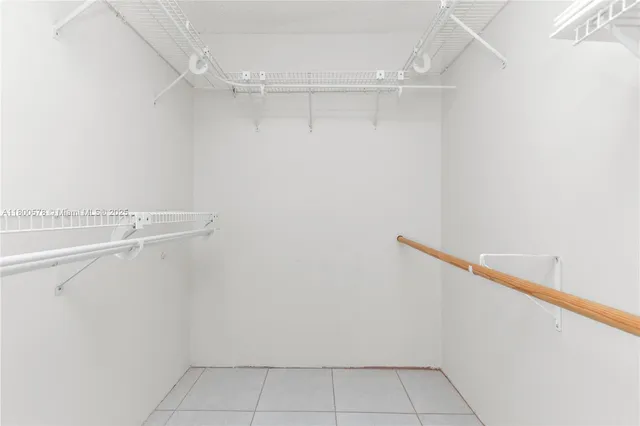 a bathroom with a bathtub shower sink vanity mirror and toilet