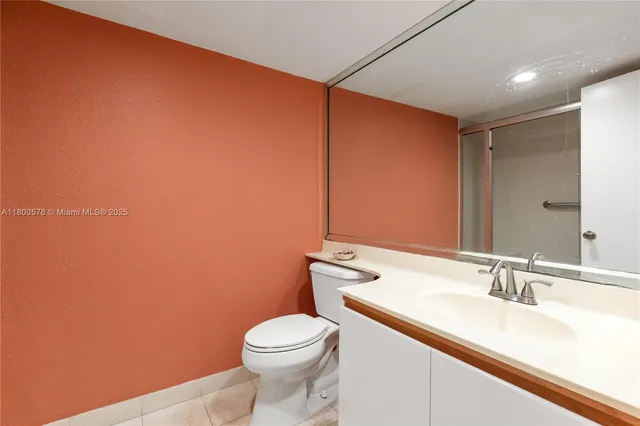 a view of an empty room with closet area