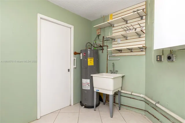 an aerial view of a houses with yard