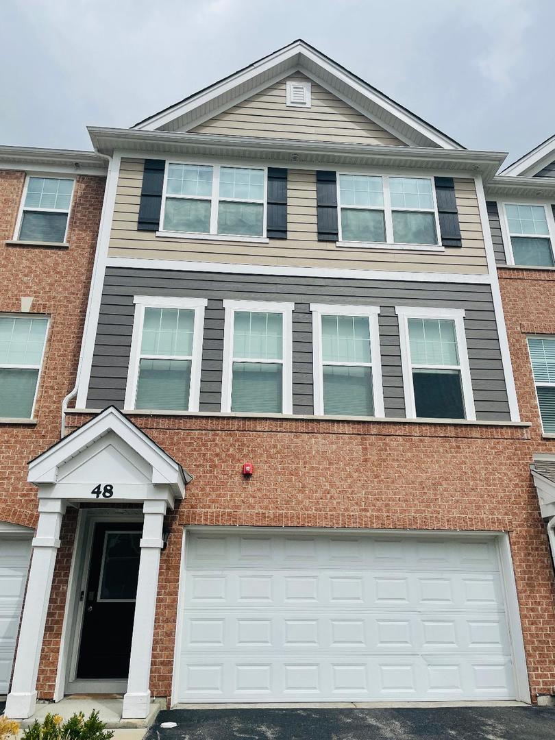 48 Grey Wolf Drive Wheeling, IL 60090 - Photo 2 of 23 a front view of a house