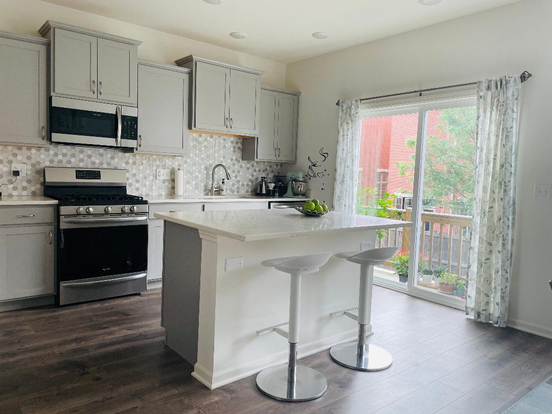 48 Grey Wolf Drive Wheeling, IL 60090 - Photo 8 of 23 a kitchen with a sink cabinets and window