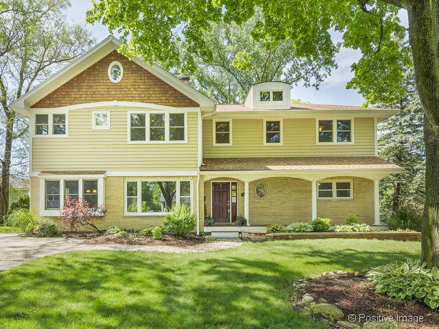 908 Ranch Road Wheaton, IL 60187 - Photo 1 of 25 front view of a house next to a yard