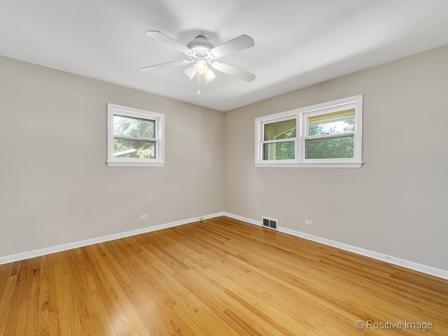 908 Ranch Road Wheaton, IL 60187 - Photo 12 of 25 a view of empty room with wooden floor