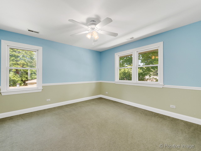 908 Ranch Road Wheaton, IL 60187 - Photo 20 of 25 a view of an empty room with a window