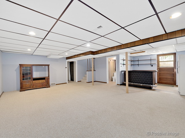 908 Ranch Road Wheaton, IL 60187 - Photo 21 of 25 a view of empty room with fireplace