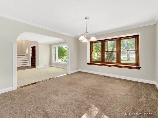 908 Ranch Road Wheaton, IL 60187 - Photo 5 of 25 a view of an empty room with a window