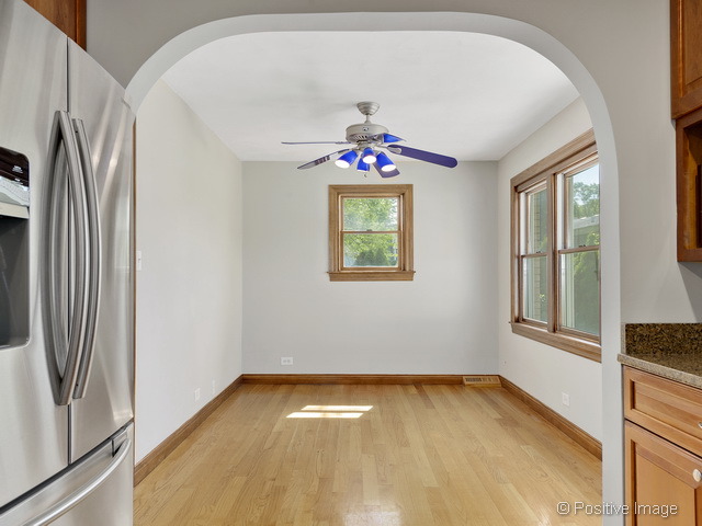 908 Ranch Road Wheaton, IL 60187 - Photo 9 of 25 a view of an empty room with a window
