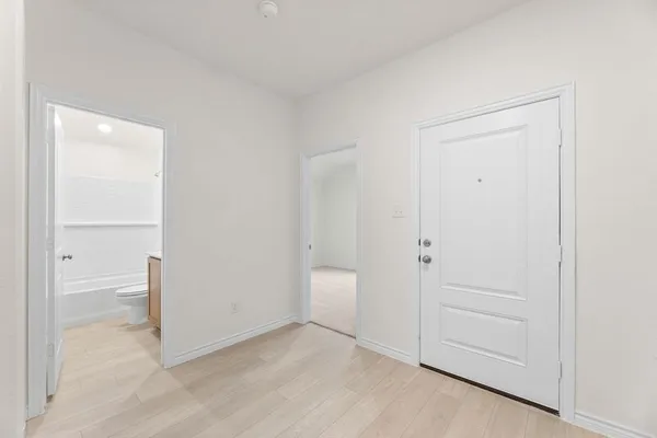 an empty room with a bathroom