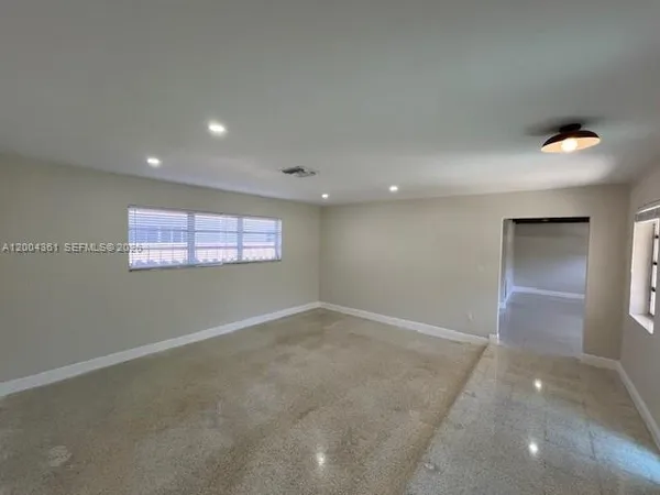 an empty room with windows