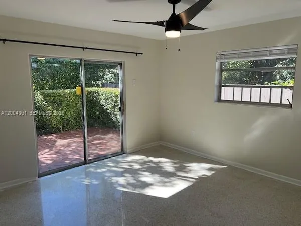 a view of a big room with windows