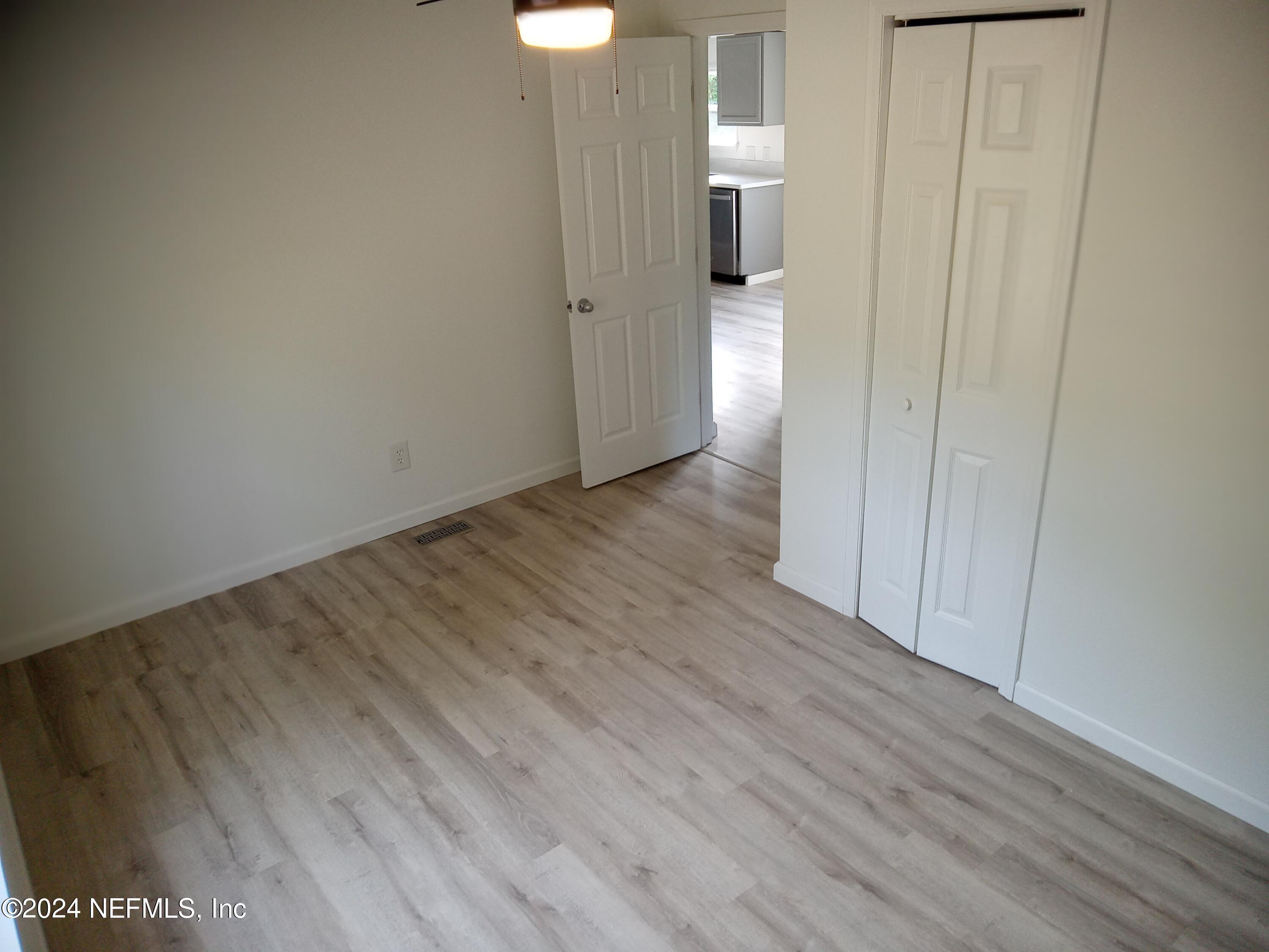 96757 Blackrock Road Yulee, FL 32097 - Photo 14 of 21 a view of a hallway with wooden floor