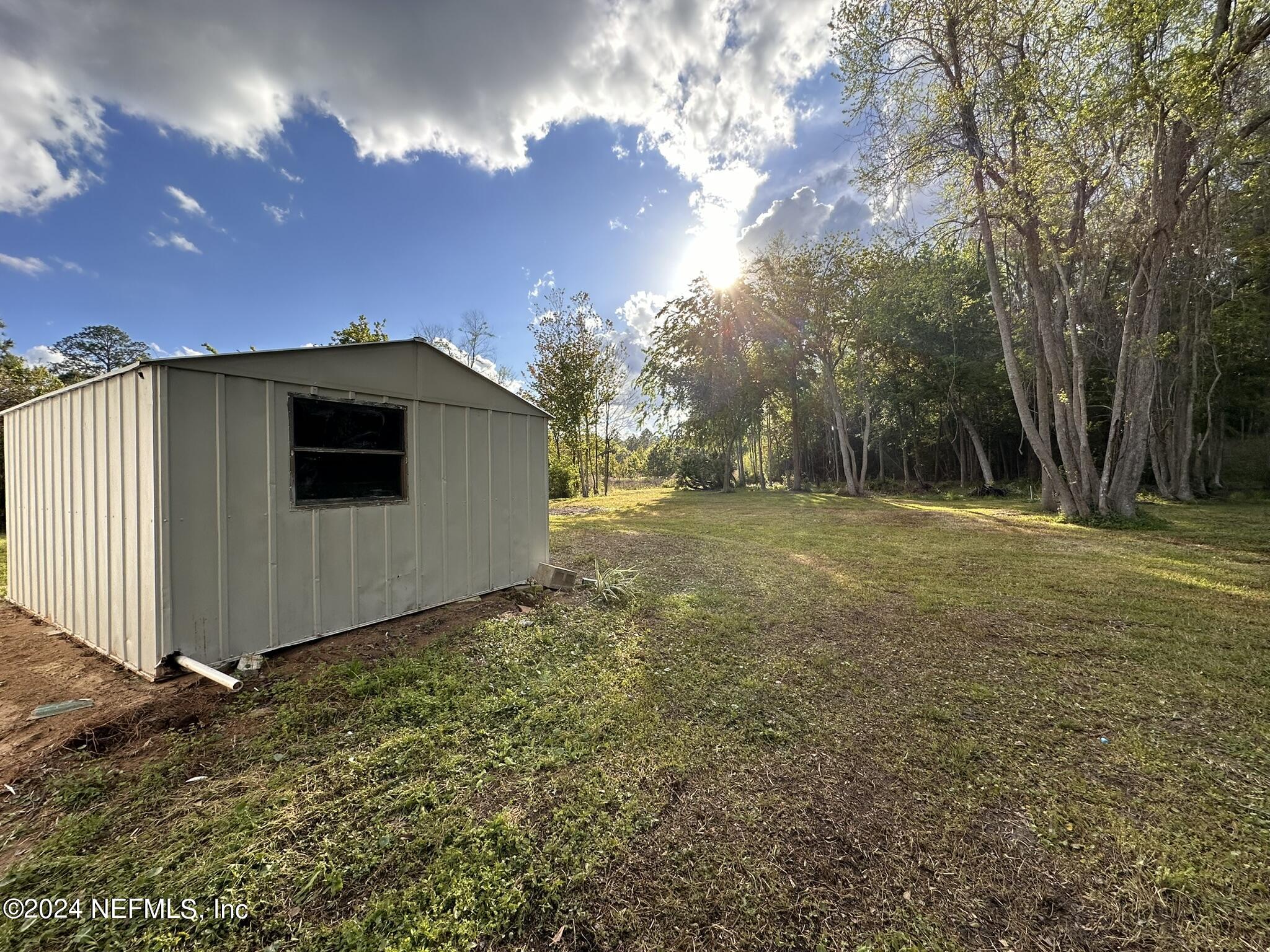 96757 Blackrock Road Yulee, FL 32097 - Photo 20 of 21 a view of a backyard