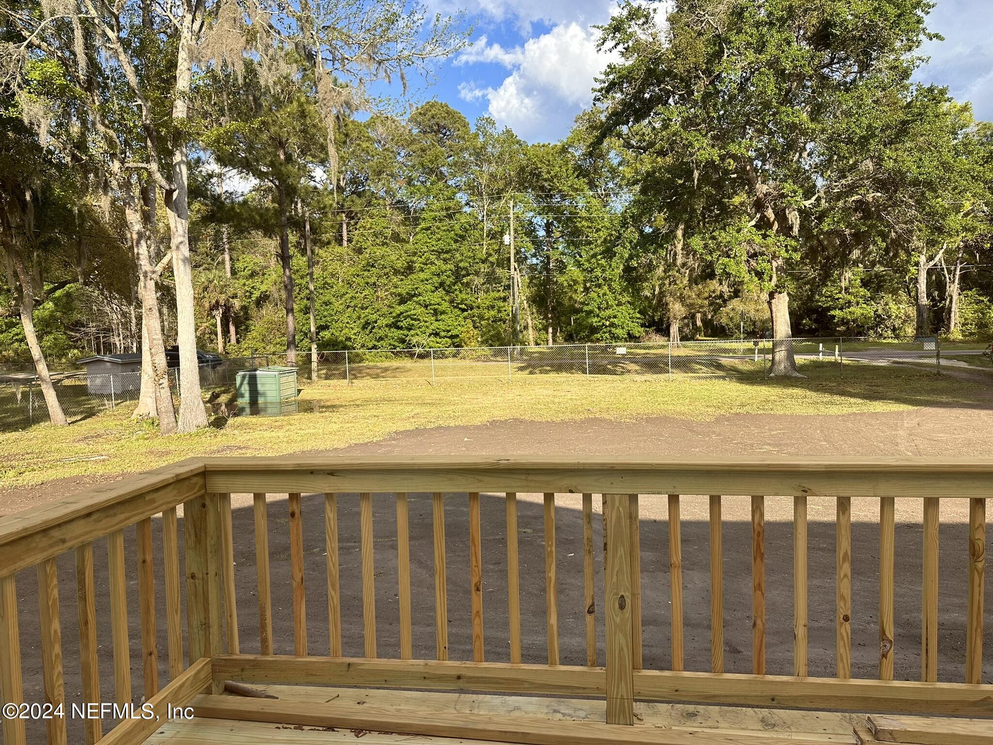 96757 Blackrock Road Yulee, FL 32097 - Photo 9 of 21 a view of wooden fence and a yard