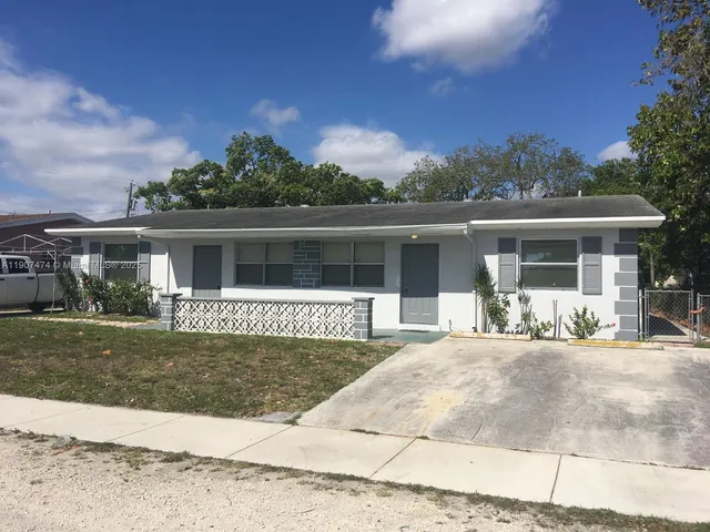 front view of a house with a patio