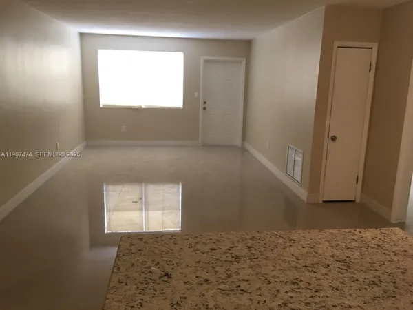 a view of an empty room and window