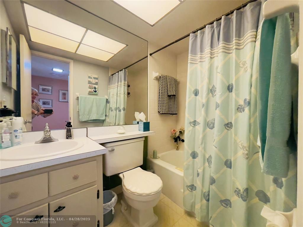 651 Pine Drive, Unit 207 Pompano Beach, FL 33060 - Photo 14 of 18 a bathroom with a sink toilet vanity and shower