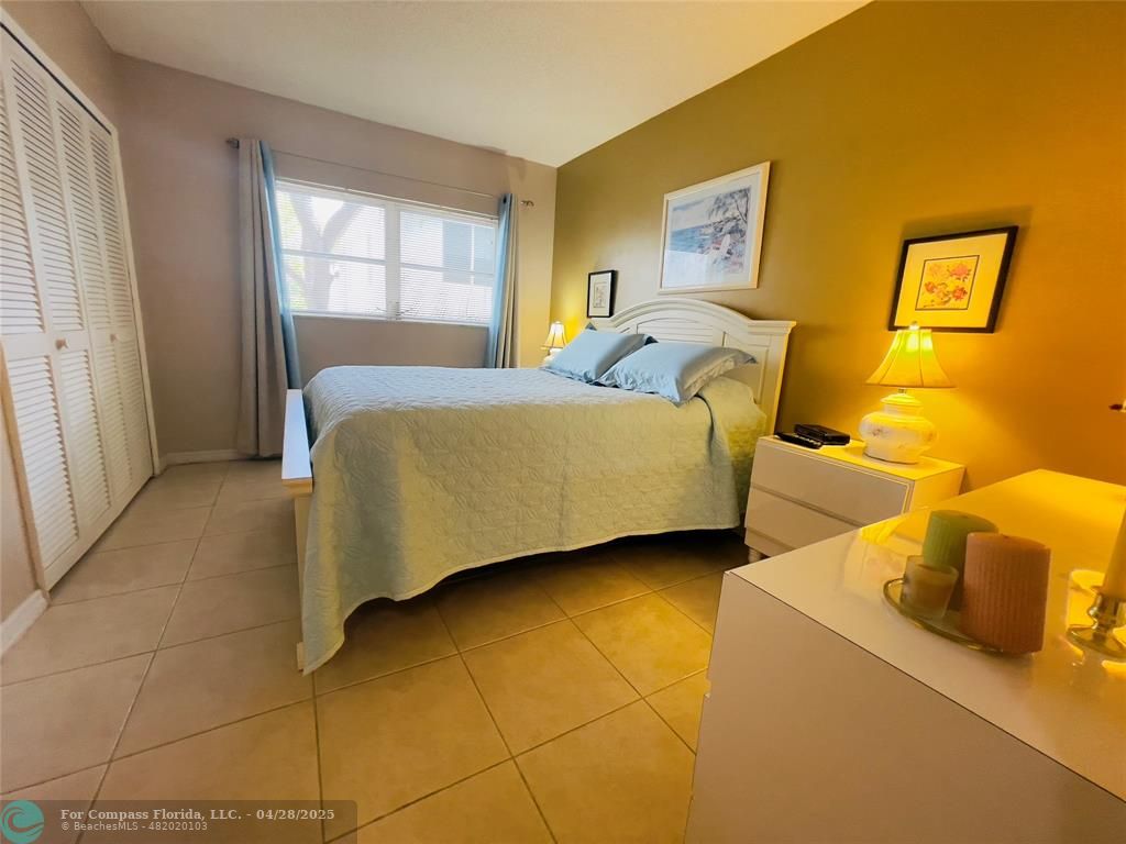 651 Pine Drive, Unit 207 Pompano Beach, FL 33060 - Photo 15 of 18 a bedroom with two beds and a window