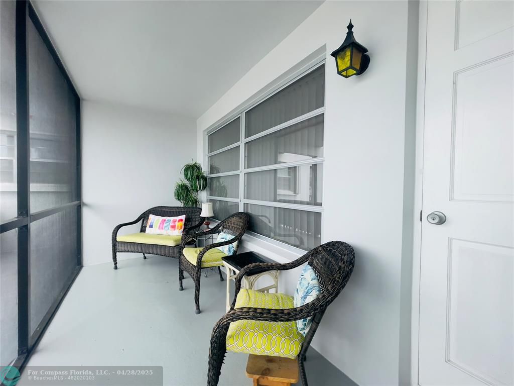 651 Pine Drive, Unit 207 Pompano Beach, FL 33060 - Photo 4 of 18 a reading room with furniture and wooden floor