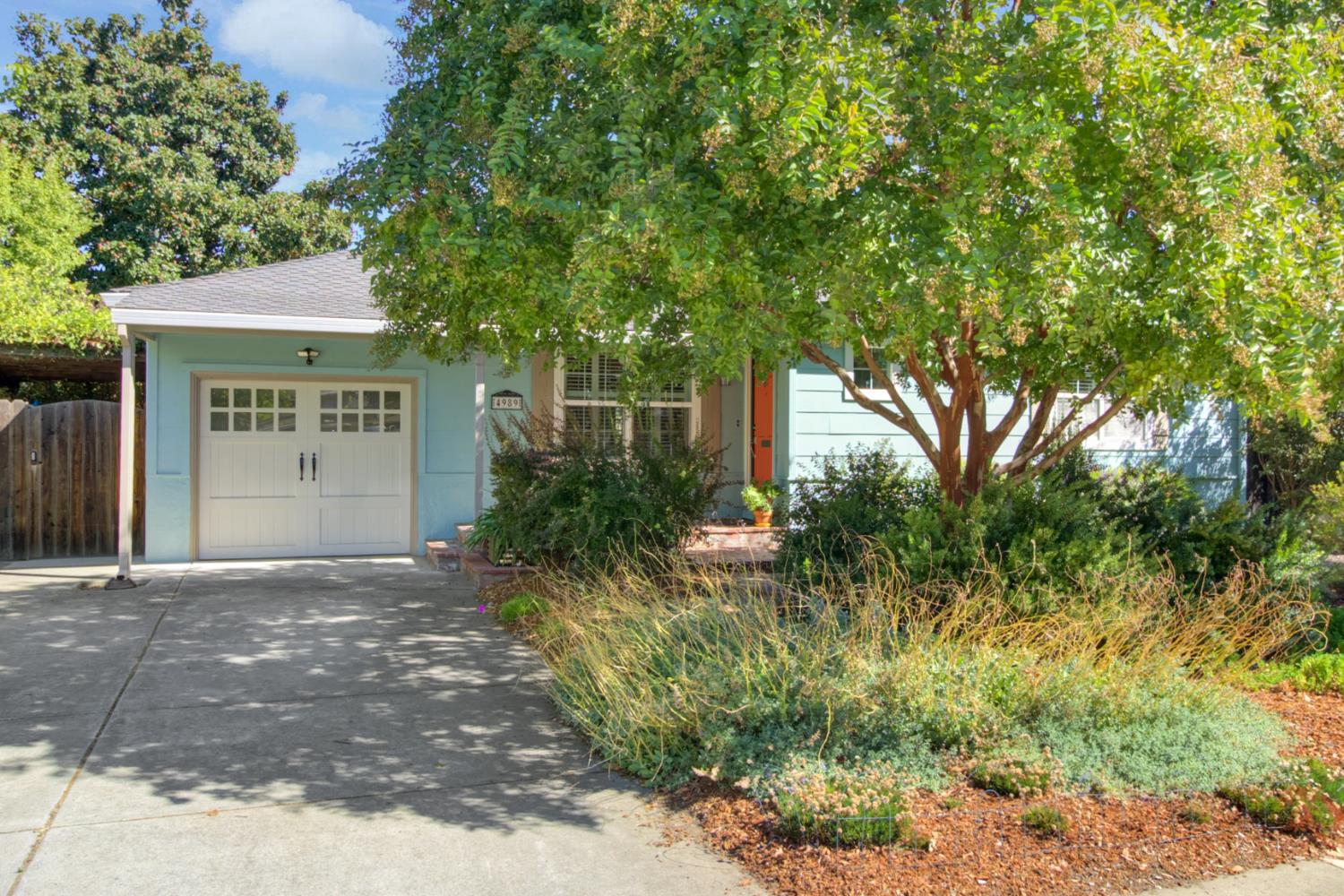 4989 Virginia Way Sacramento, CA 95822 - Photo 1 of 1 a view of a house with a tree