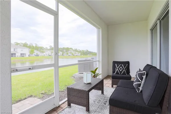 a balcony with furniture and city view
