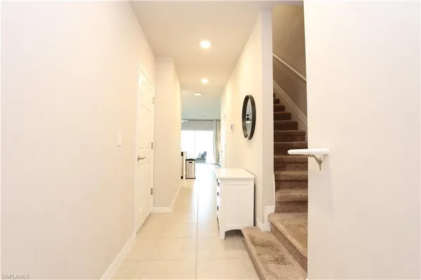 a view of a bathroom with a shower and mirror