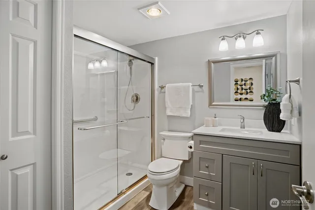 a workspace room with furniture and a potted plant