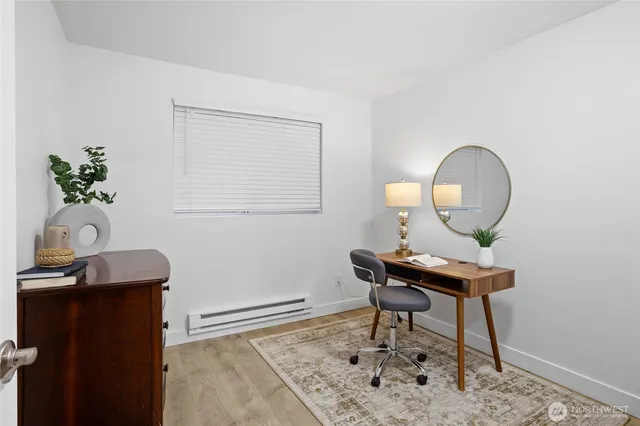 a view of a patio with table and chairs under an umbrella