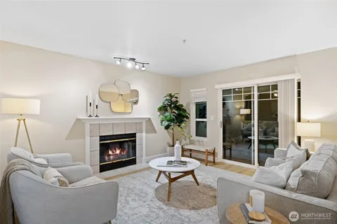 a living room with furniture and a potted plant