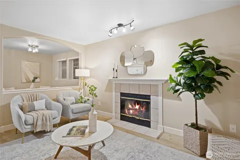 a dining room with furniture a window and wooden floor