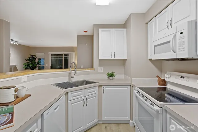 a kitchen with a sink and cabinets