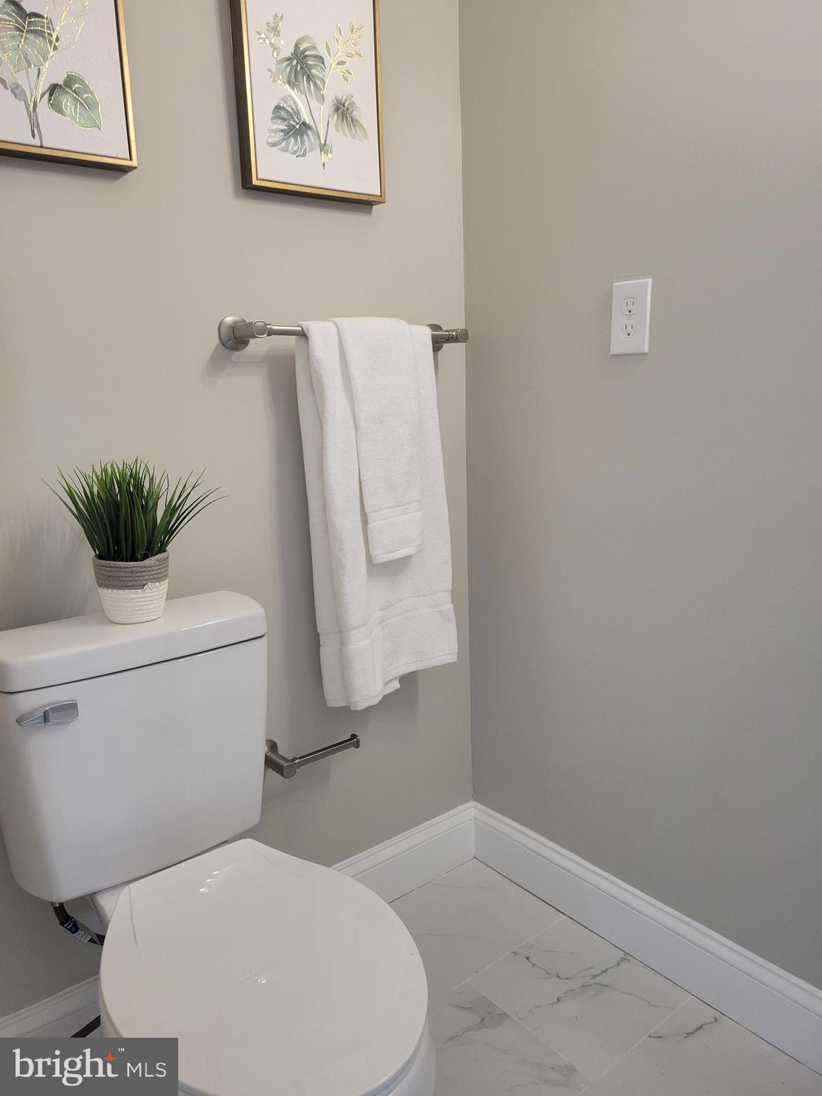 5303 Emory Road Upperco, MD 21155 - Photo 11 of 33 a white toilet sitting next to a small bathroom