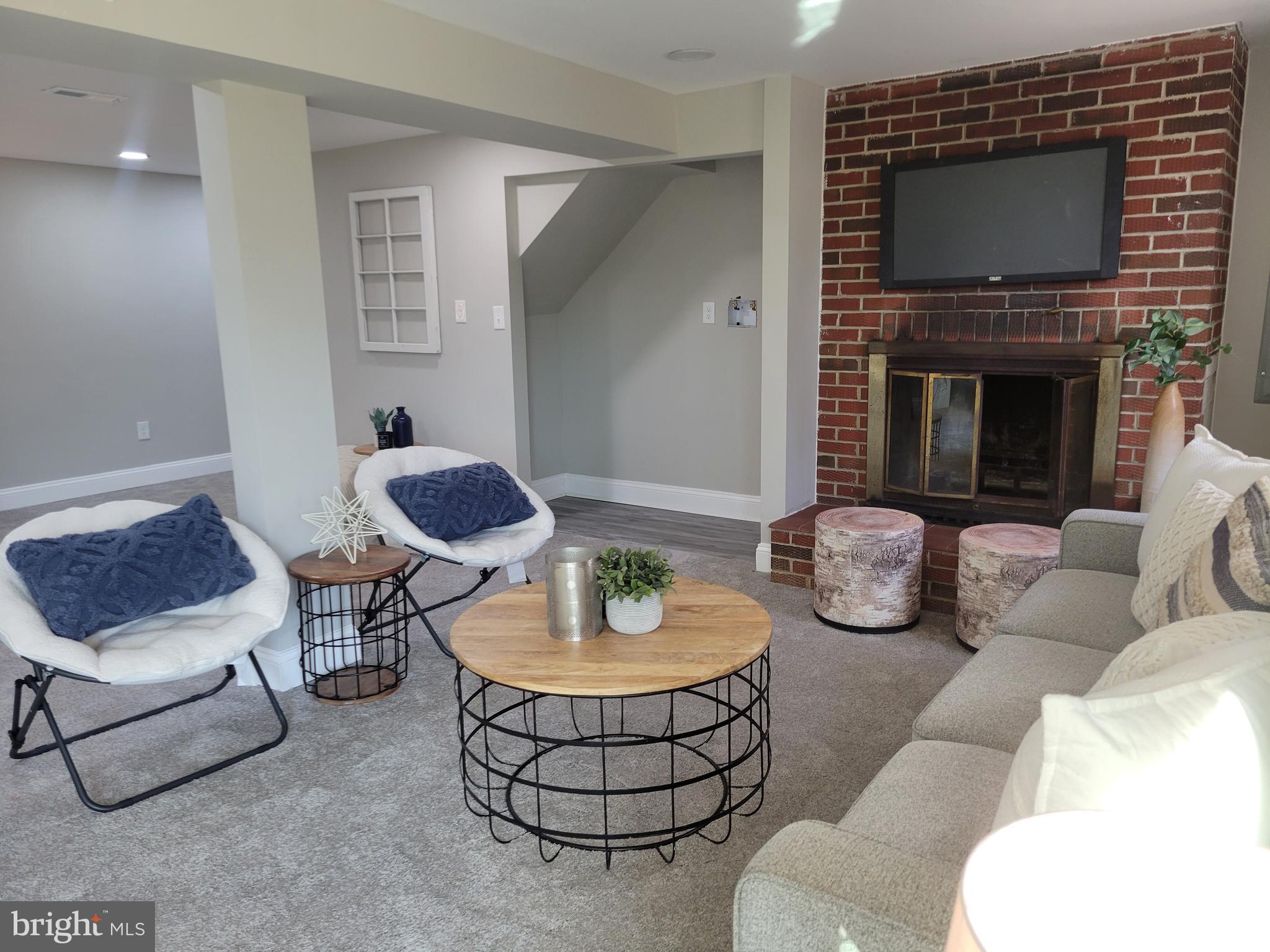 5303 Emory Road Upperco, MD 21155 - Photo 15 of 33 a living room with furniture and a fireplace