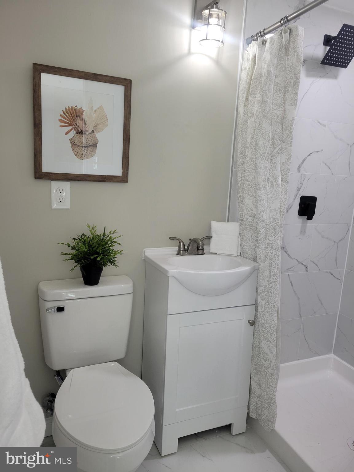 5303 Emory Road Upperco, MD 21155 - Photo 17 of 33 a white toilet sitting next to a bathroom sink