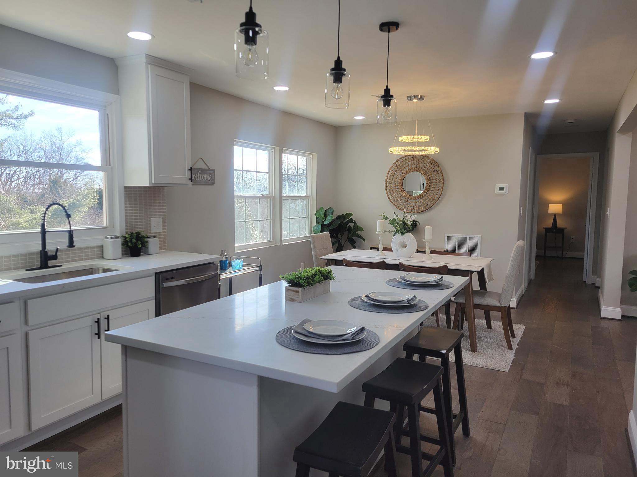 5303 Emory Road Upperco, MD 21155 - Photo 5 of 33 a kitchen with a dining table and chairs