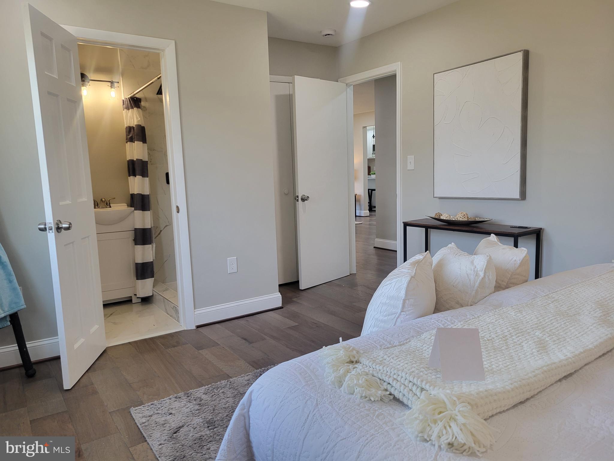 5303 Emory Road Upperco, MD 21155 - Photo 10 of 33 a bedroom with a large bed and walk in closet