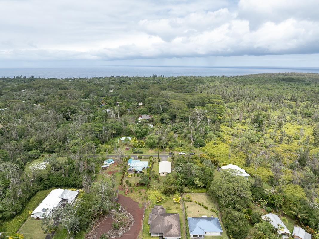 15-2808 Moi Street Pahoa, HI 96778 - Photo 10 of 11 an aerial view of residential houses with outdoor space