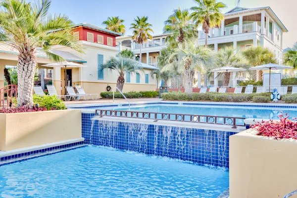 a building outdoor space with patio furniture and potted plants