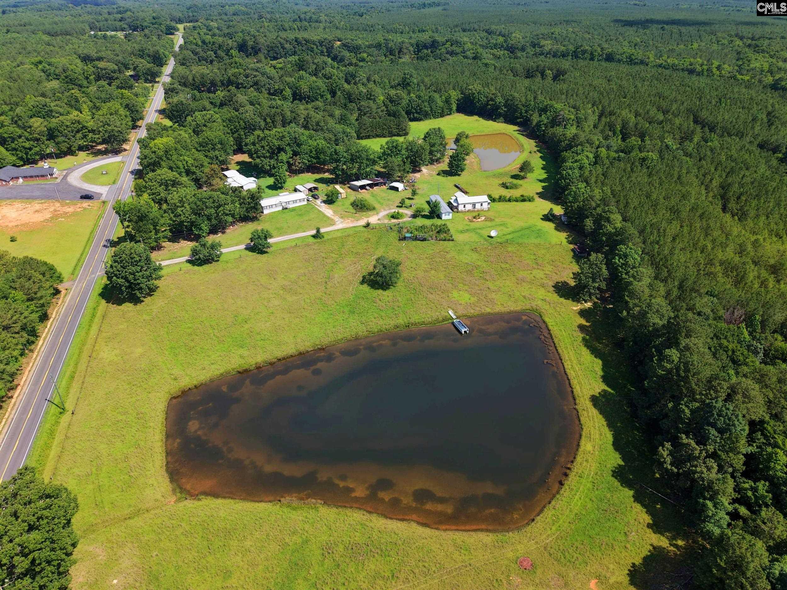 3140 Highway 702 Chappells, SC 29037 - Photo 2 of 39 a view of a swimming pool with a yard