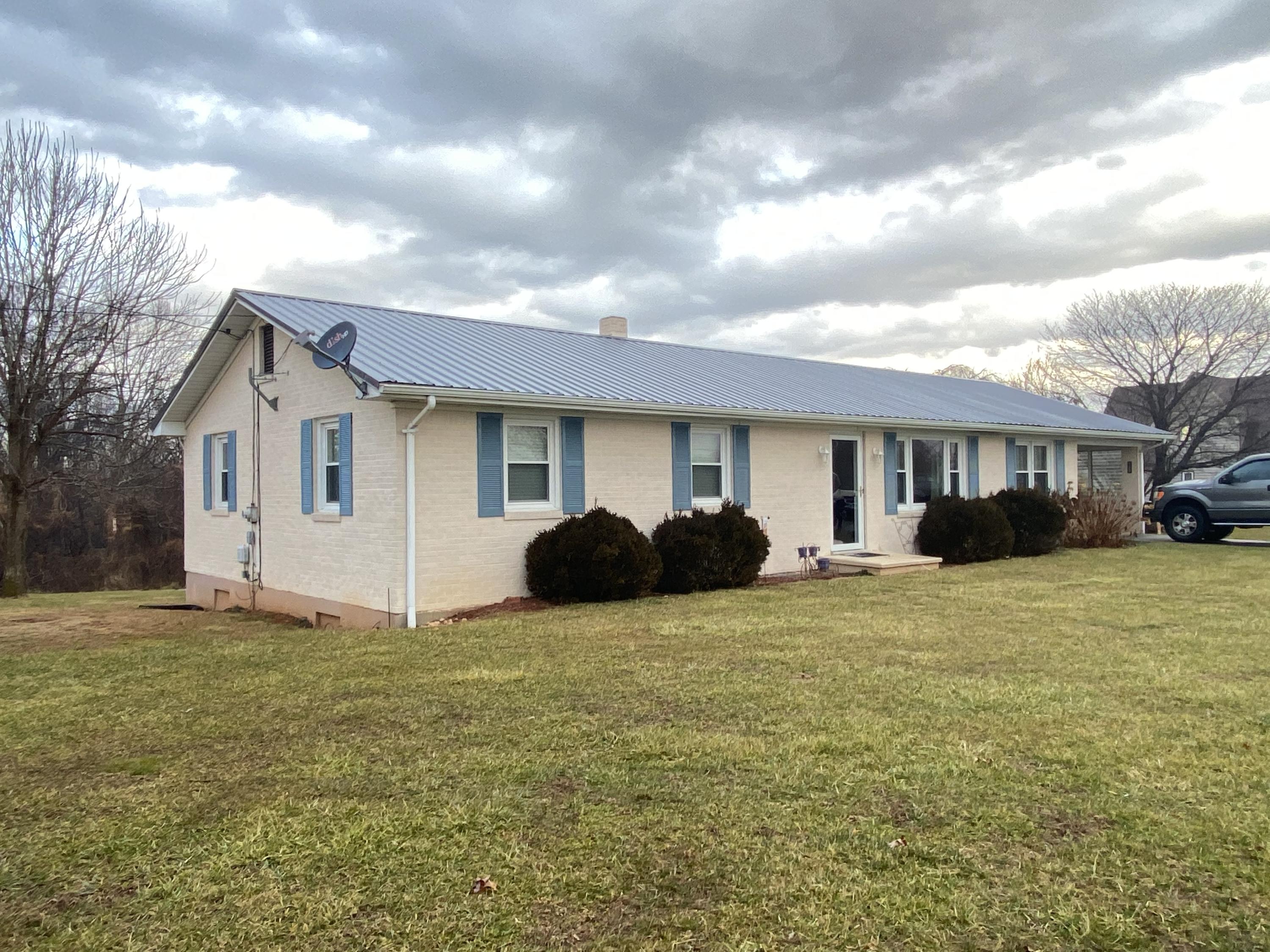 1171 Rock Spring Road Goodview, VA 24095 - Photo 2 of 29 a view of a house with a yard