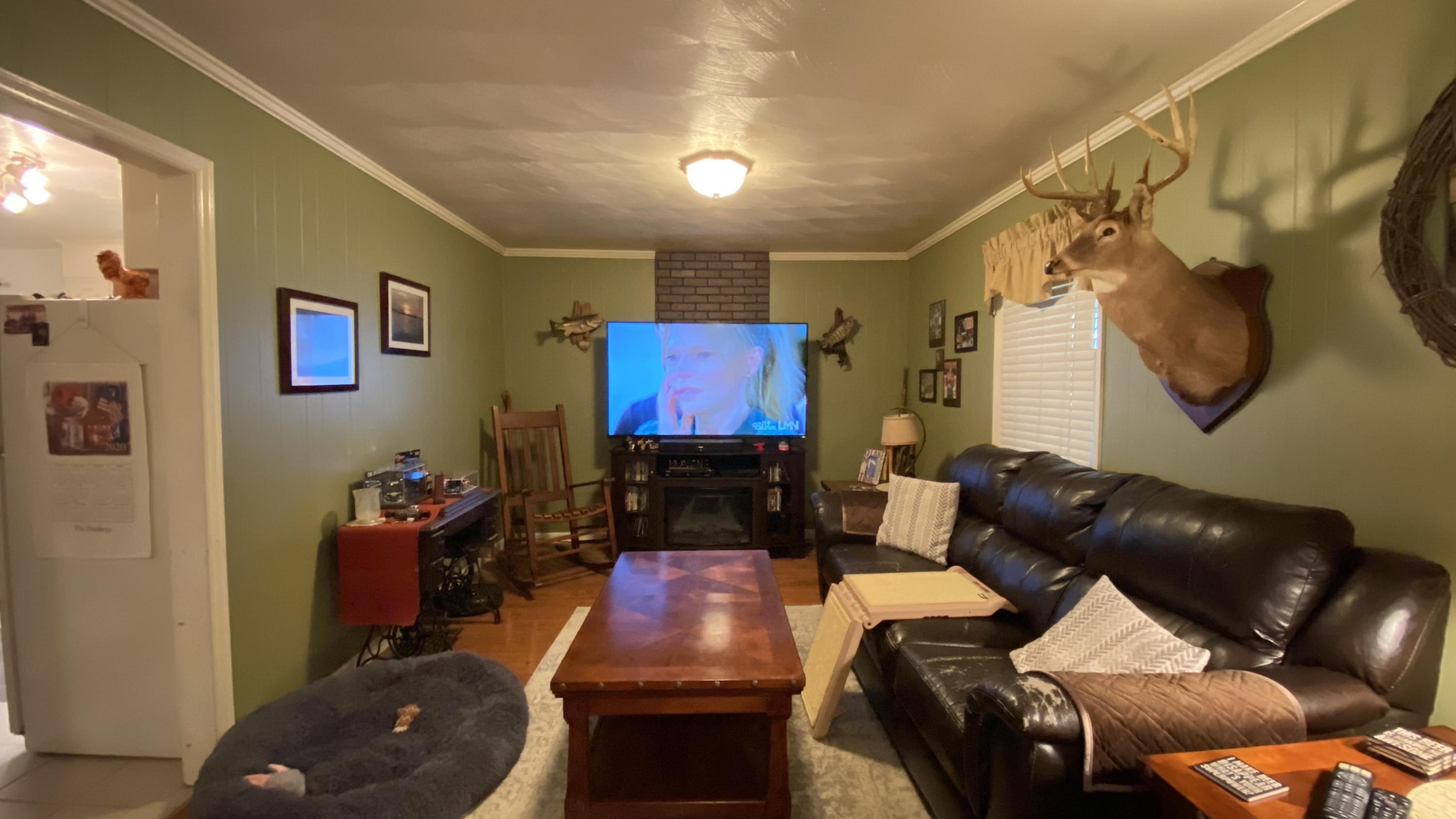 1171 Rock Spring Road Goodview, VA 24095 - Photo 13 of 29 a living room with furniture and a flat screen tv