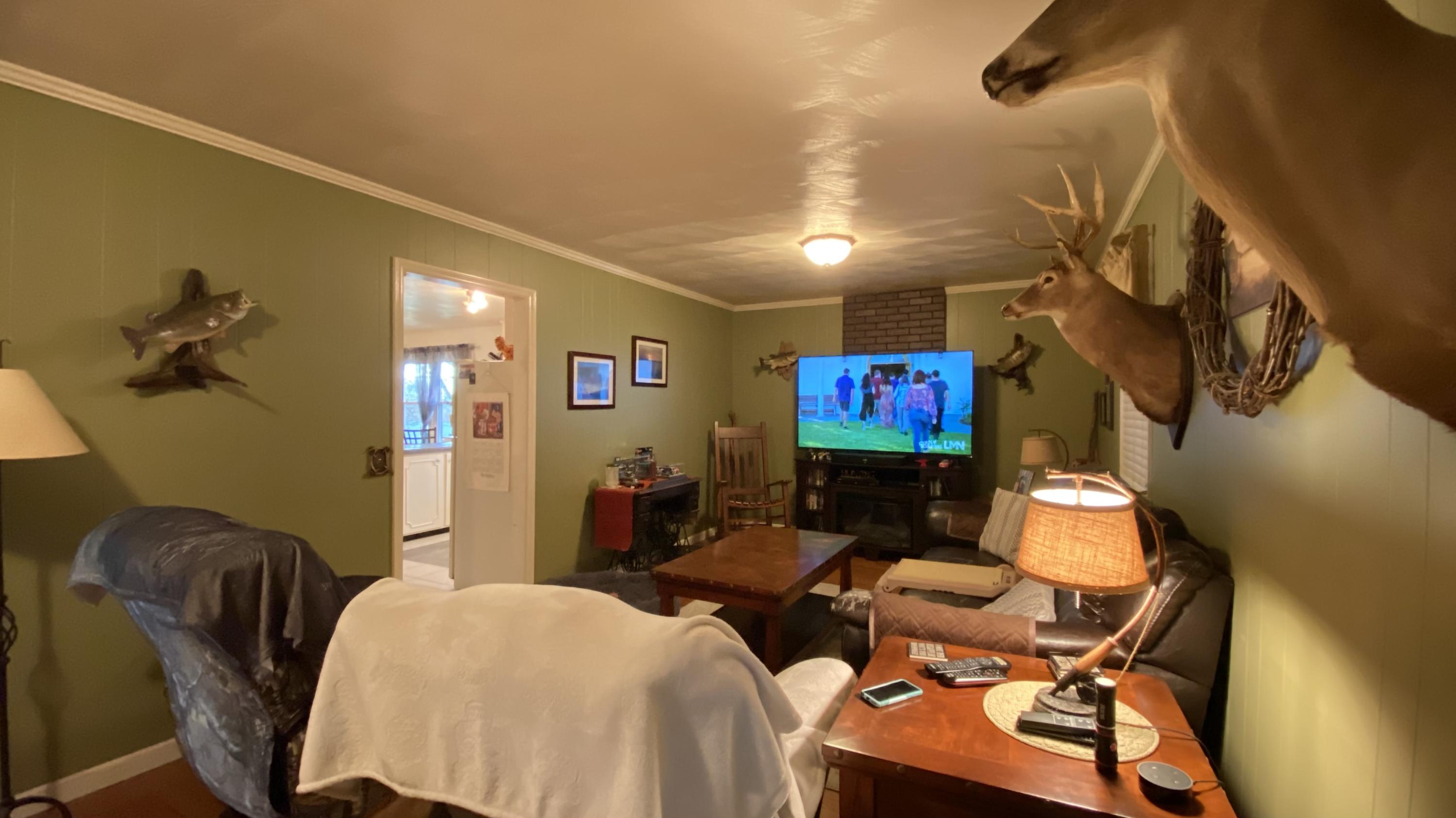 1171 Rock Spring Road Goodview, VA 24095 - Photo 14 of 29 a bedroom with furniture and a flat screen tv