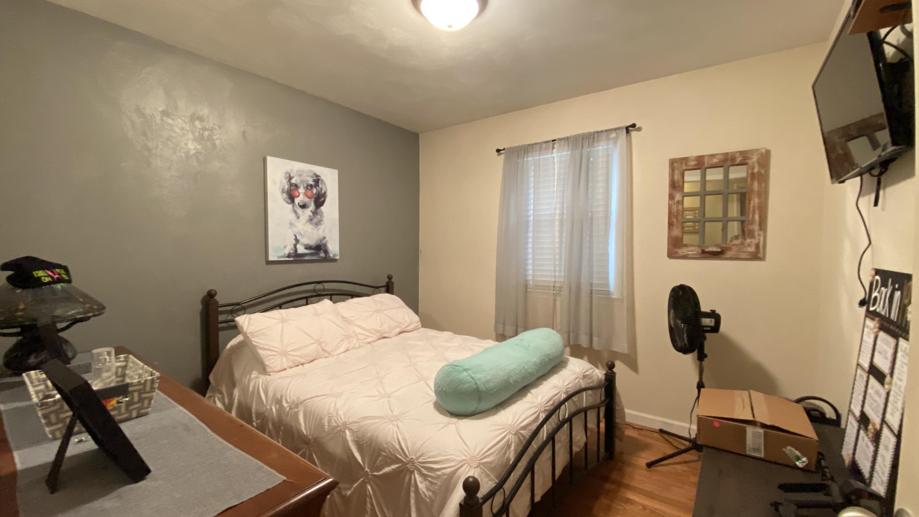 1171 Rock Spring Road Goodview, VA 24095 - Photo 20 of 29 a bedroom with a bed and a flat screen tv