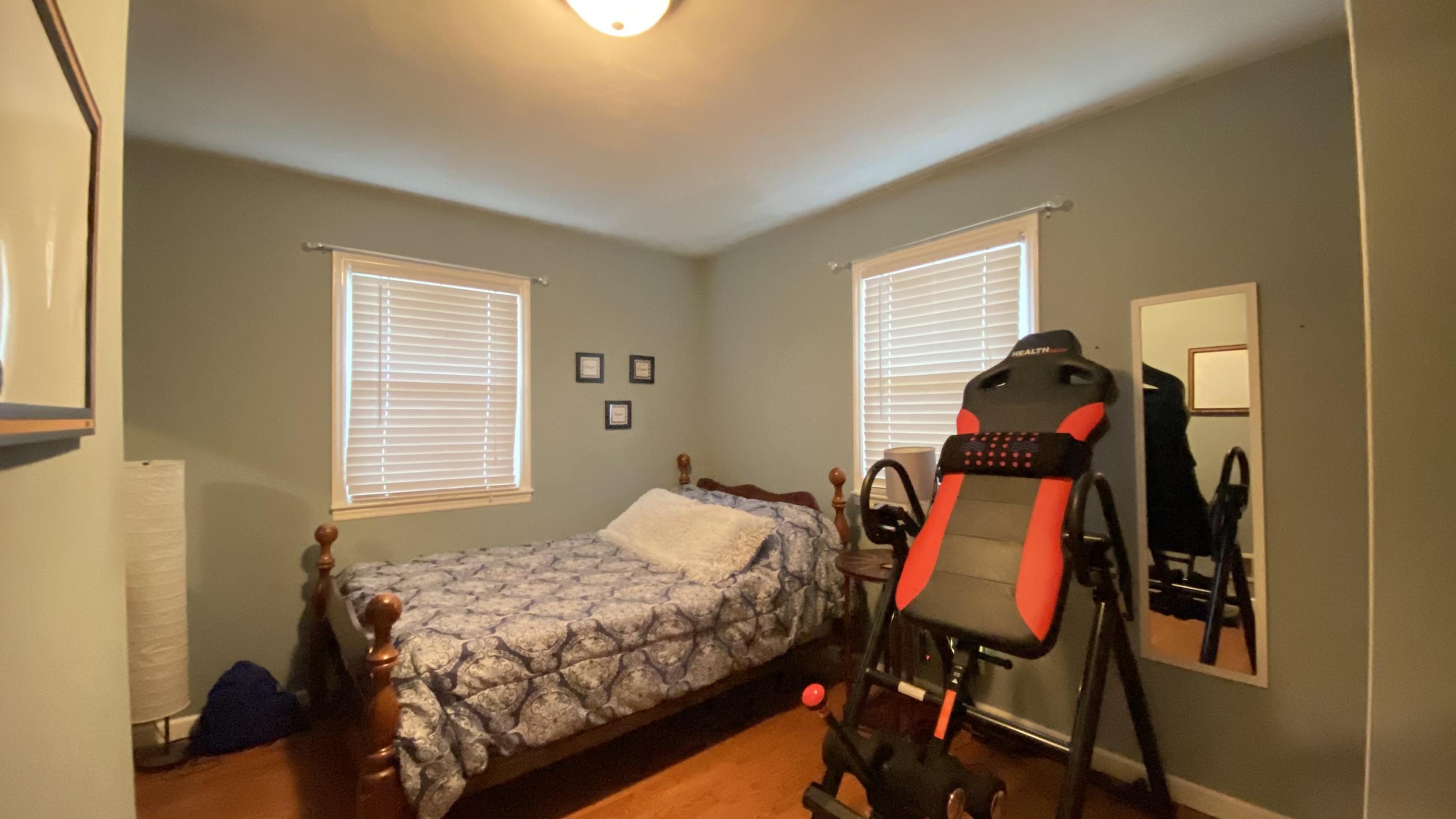 1171 Rock Spring Road Goodview, VA 24095 - Photo 21 of 29 a bedroom with a bed and a window