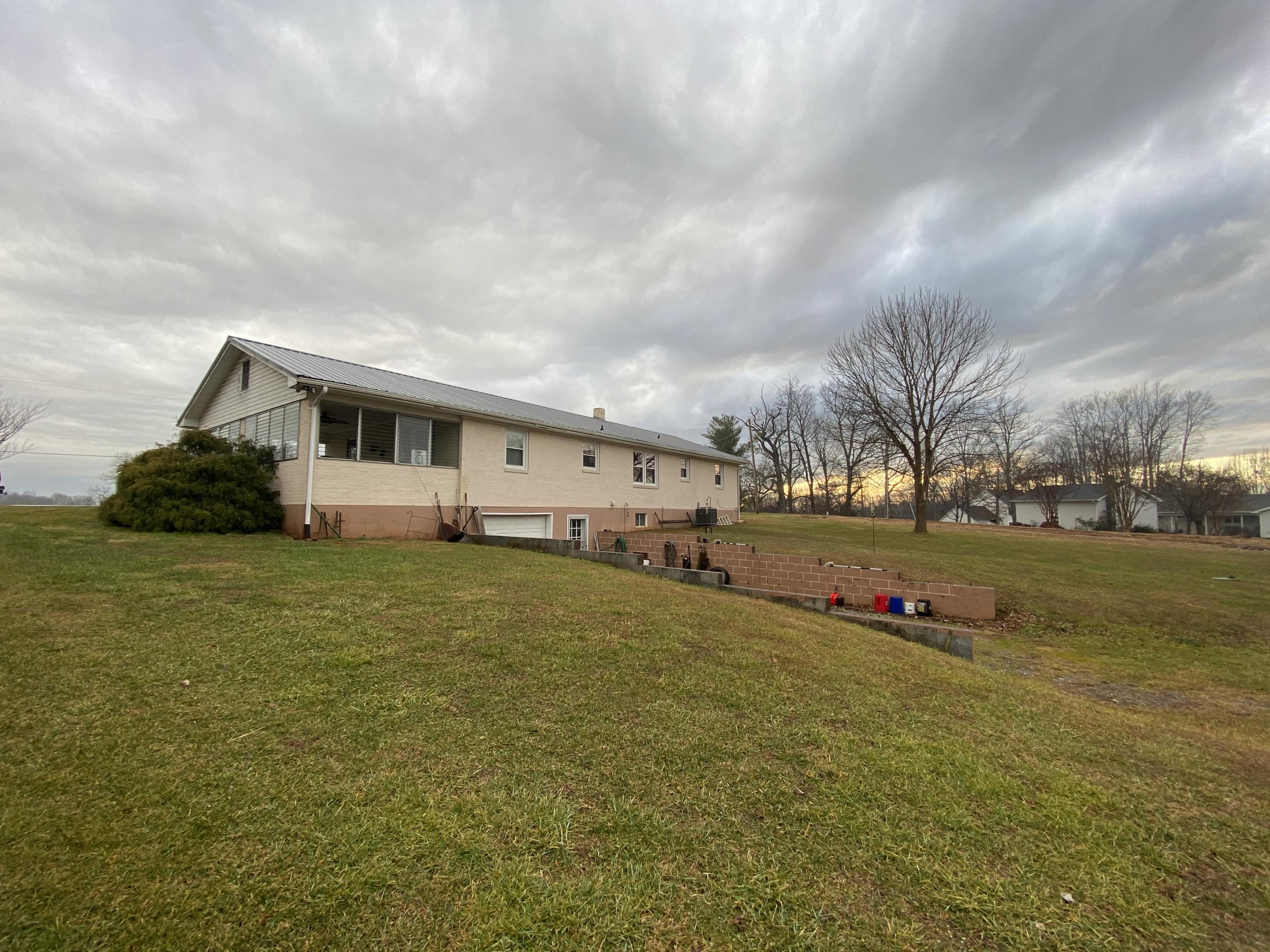 1171 Rock Spring Road Goodview, VA 24095 - Photo 26 of 29 a view of a house with a yard