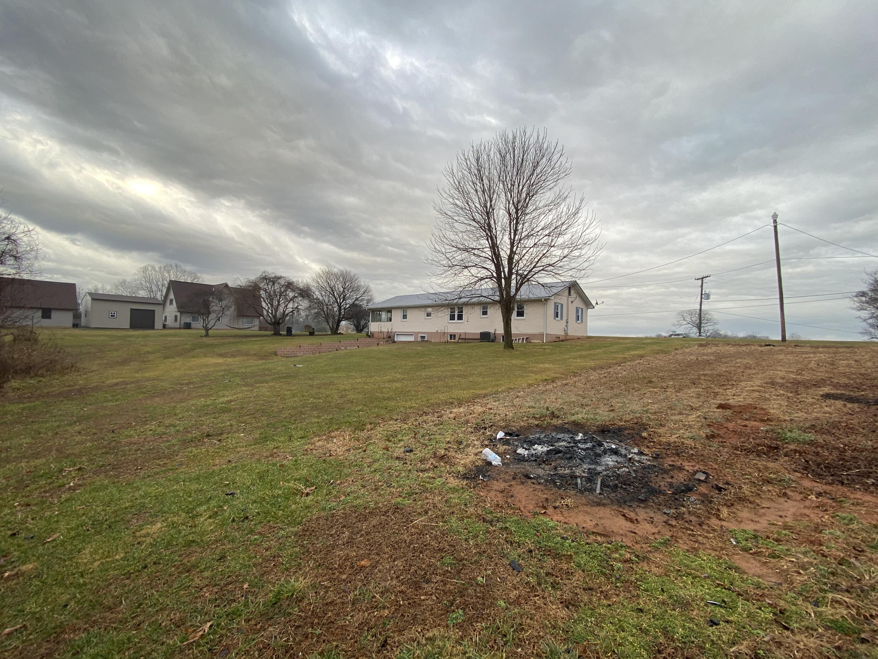 1171 Rock Spring Road Goodview, VA 24095 - Photo 28 of 29 a view of a large tree with an outdoor space