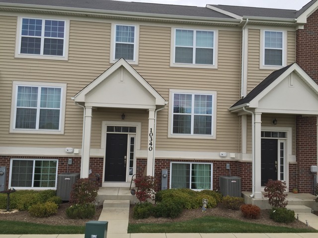10340 Kerry Ridge Court Chicago Ridge, IL 60415 - Photo 1 of 14 a front view of a house with yard and green space