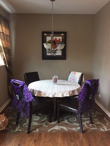 10340 Kerry Ridge Court Chicago Ridge, IL 60415 - Photo 4 of 14 a dining room with a table chairs and a chandelier