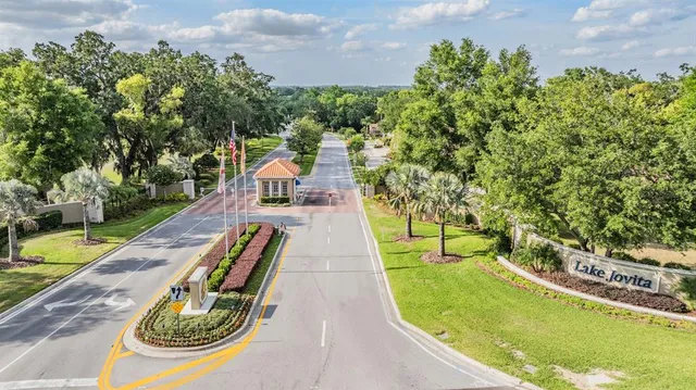 swimming pool view with a garden space