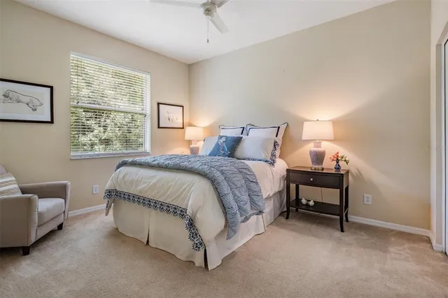 a spacious bedroom with a bed and a couch